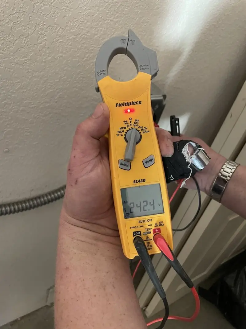 Voltage testing with clamp meter during Ceiling Fan Installation in Childersburg